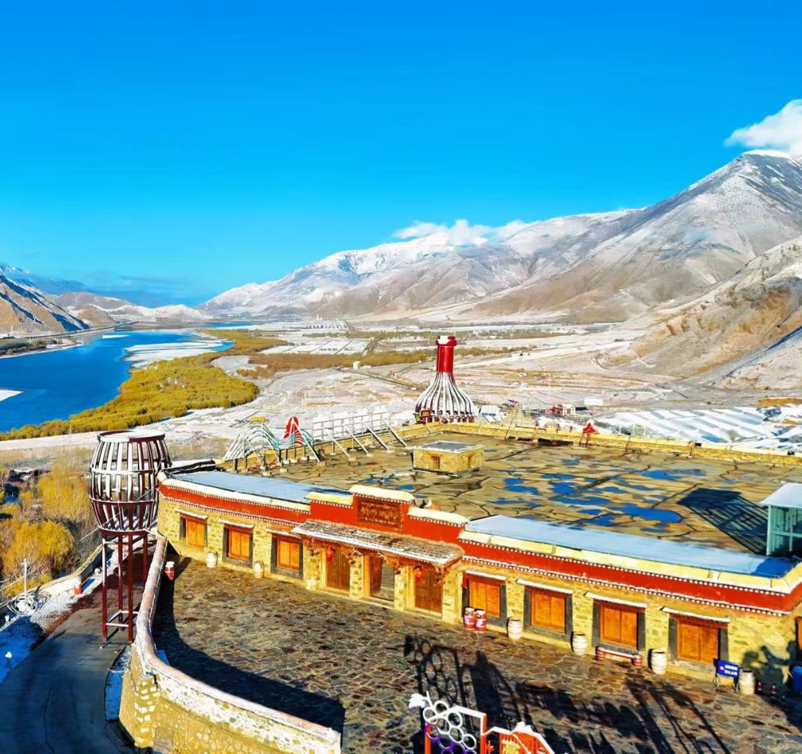 The estate overlooking the valley, river and snow mountains beyond